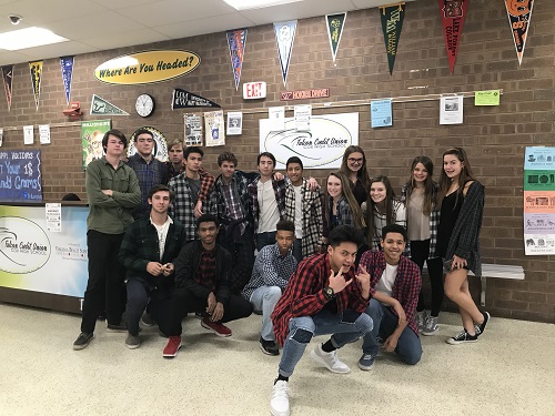 STUDENTS POSE IN flannel for spirit week.