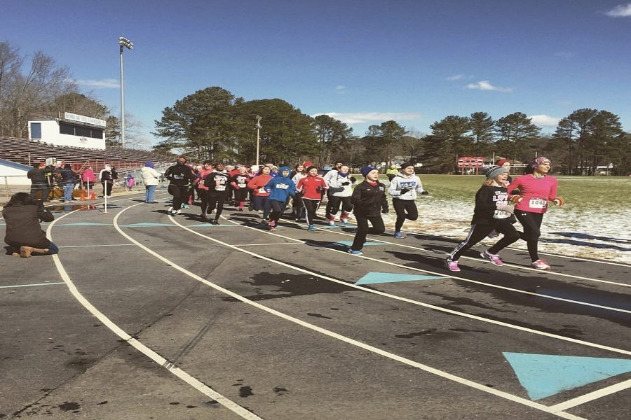 STUDENTS TAKE OFF on their 5K race for the Love Run