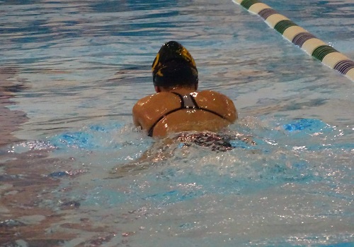 A SWIM TEAM member glides through the water.