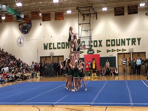 THE VARSITY CHEERLEADING team performs during the winter pep rally. The sideline cheer team performs at basketball games along with at school events.
