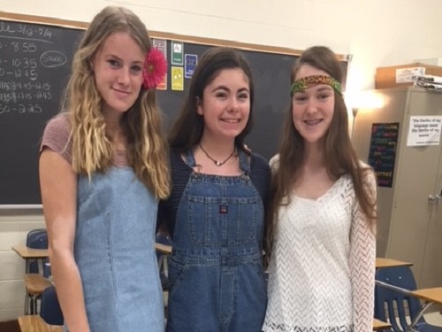 SOPHOMORES SARAH SPEAR, Sydney Manlove, and Ann Staskin show school spirit by dressing up for decades day.