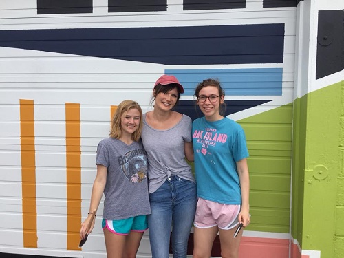 NAHS STUDENTS ALEXA Marshall and Leandra Cameron, along with sponsor Jessica Syzmanski helped a local artist at the 10 Murals in 10 days event at the oceanfront last weekend.