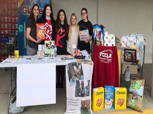 FCCLA ADVISOR RAENA Weimer (left to right) and students Julia Shukis, Ivory Kamzura, Anastasia Owens, and Piper Kamzura collected donations for Wildlife Response Inc. last weekend.