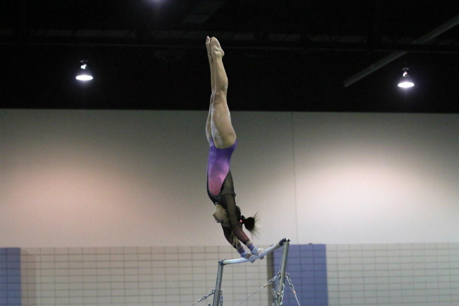 SENIOR LEAH SMITH performs her gymnastics routine.