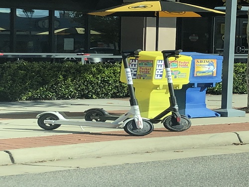 THE BIRD SCOOTERS sit on the side of roads around the city.  These two were dropped off near Buffalo Wild Wings on 31st  Street at the Oceanfront. 