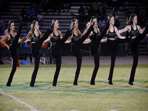 THE COQUETTES ARE dancing at the football game. They did a kick line at halftime.  