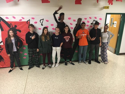 FRESHMAN STUDENTS STEP into the hallway to take a picture, on their first school spirit day. This was their first spirit day in high school.