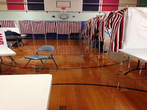 A POLLING STATION is set up in a New Hampshire public school.  Around the country there are polling stations set up in different schools, churches, and other common places for people to cast their votes. 