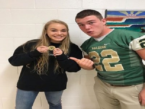 SENIORS CAYLA KATZ and Jackson Morgan show off their new Principals Coin they received on Friday.  The two seniors were named as the first Student-Athletes of the Week.