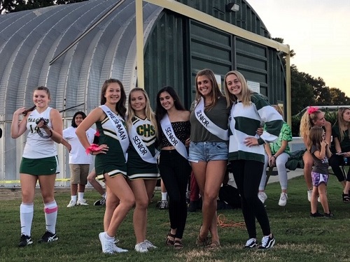 HOMECOMING COURT ATTENDS the bonfire. They were voted for by the student body.