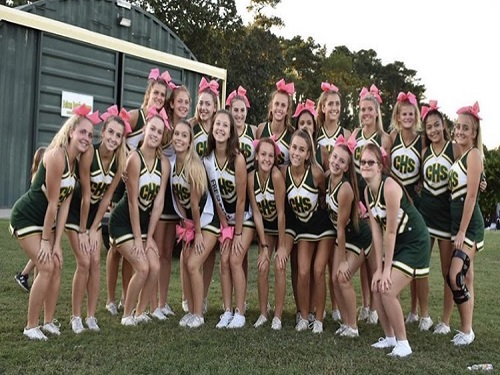THE CHEERLEADERS SHOW school spirit at the bonfire. They had a blast performing for students and staff.