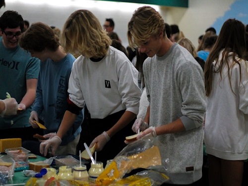 SOPHOMORE BARRETT FOSTER and junior Riley Rawls attend #lunchbag.  They helped the school make sandwiches for people in need.