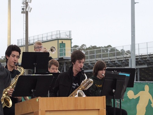 BAND STUDENTS COME together in harmony to celebrate the opening of the Falcon Wing. The band members have been perfecting their performance for the ribbon-cutting ceremony for weeks.