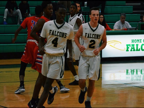 SENIOR SOUTH TRIMBLE runs to set up defensively during the game against Princess Anne. The Falcons won 81-76 in the second overtime on Tuesday, December 11.