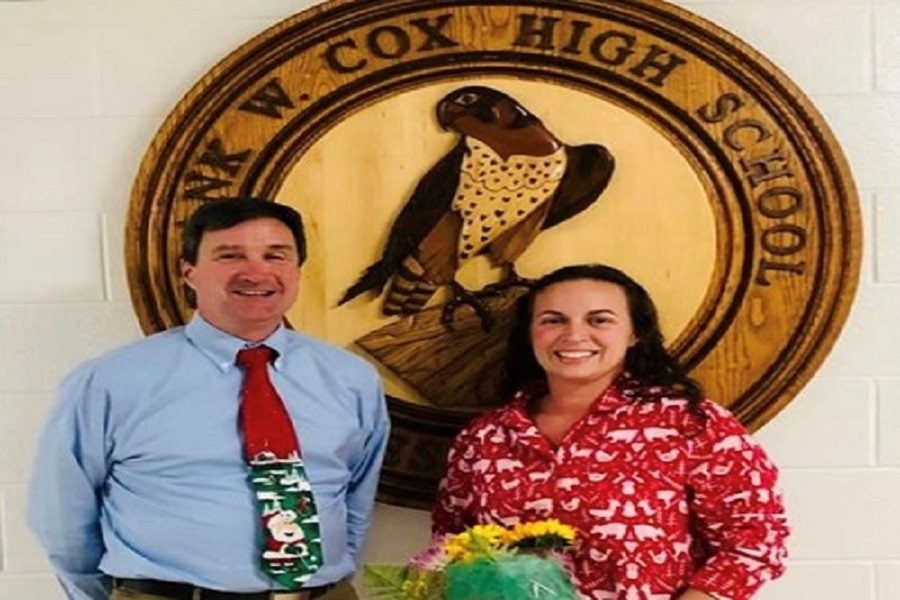 PRINCIPAL DR. MICHAEL Kelly and the newest Teacher of the Year Melissa Rusak stop for a quick picture in front of the schools mascot.  Rusak was named as the 2019-2020 TOY on Monday afternoon.