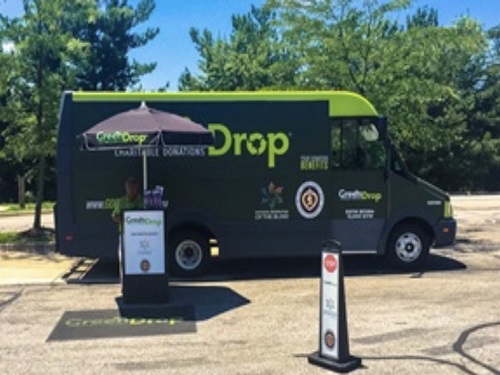 A GO GREENDROP truck sits at the pick up location in Woodbridge, Virginia. Those who donated were greeted by an attendant to move their items into the facility. 