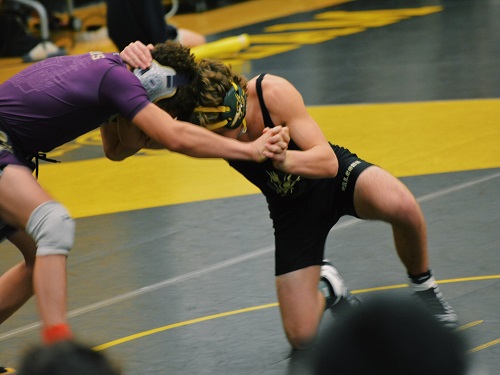 SOPHOMORE WES SCHLEMMER (138 lbs.) uses great strategy and quick movement to surprise his competitor. The young athlete quickly pinned his opponent and took the win for his match.