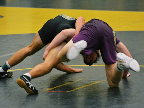 SENIOR DALTON LoALBO (152 lbs.) got caught in the action during this intense round. He held his own against the cutthroat Lions.