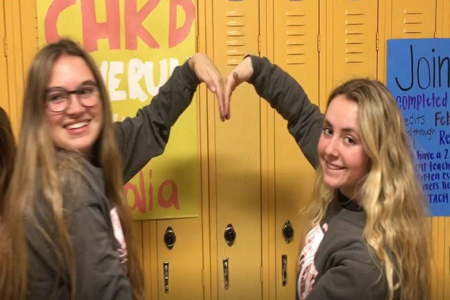 SOPHOMORE SAVANNAH GIBSON (left) and senior Chloe Jones show us their heart in effort to promote the upcoming CHKD Love Run/Walk for children on Saturday, Feb. 16.  The annual event, hosted by CHS and Princess Anne High School, has raised over $90,000 over the years.