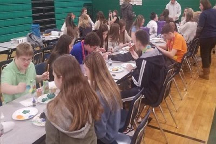 OPERATION SMILE CLUB and Beach Buddies Club meet up to eat pizza and make crafts in the school's gym this week. The two organizations are teamed together to plan the first ever Buddies Helping Buddies Leadership Workshop on Saturday, March 2 .