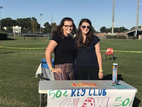KEY CLUB SECRETARY Tessa Thibodeau and Key Club member Jessica Miller pose for a picture. The girls set up a Key Club booth at the schools bonfire last fall. 
