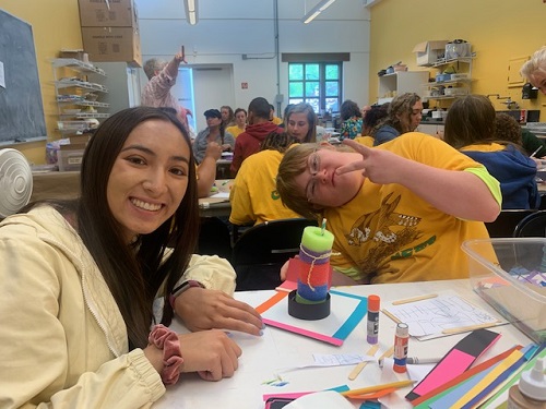 SENIOR MARINA PHAM assists her Art buddy at the MOCA Event. Pham made a variety of artwork with students.  
