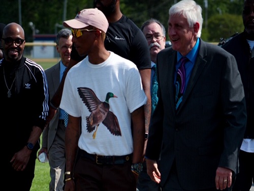 MAYOR OF VIRGINIA Beach, Bob Dyer, poses next to Virginia native Pharrell Williams on Wednesday, April 24, at the Battle of the Bands. Williams started the Battle of the Bands to showcase the great music programs of Virginia Beach City Public Schools. 