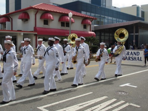 MARCHING SAILORS PERFORM for the crowd at the Neptune Festival. The performers marched along the Ocean Front as the spectators cheered them on. 