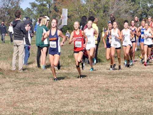 CHS FRESHMAN RUNNERS race to finish first for their team. The freshman unit has led the girls team through the regular season. 