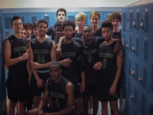 FALCON BOYS BASKETBALL is all-smiles after their win over rival FC. The team has a 11-6 season record.
