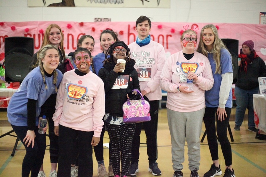 STUDENTS INVOLVED WITH Beach Buddies gather together to participate in the Love Run event. The goal was to raise money to benefit the children of CHKD and bring smiles to their faces.