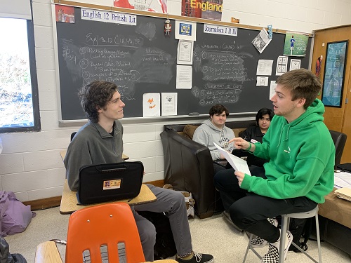 SENIORS TANNER BAILEY (right) and Finley Legg model the way professionals will speak to students at the Mock Interview. Bailey explained to Legg that students must sign up by Friday, March 6.