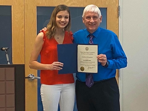SENIOR KAITLYN PISTON receives the Mayor’s Committee for Persons with Disabilities award from Mayor Bobby Dyer. Piston showed great leadership skills and determination when planning the workshop.