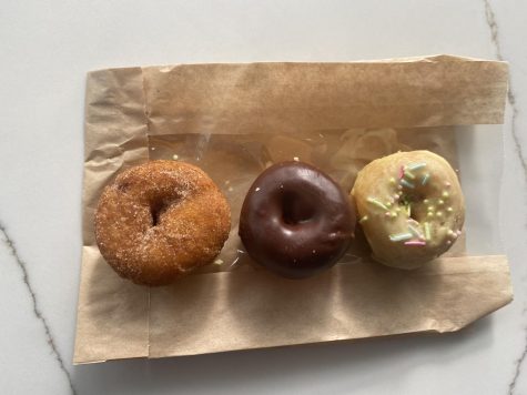 THE THREE DONUTS sit still on the napkin, seemingly waiting to be devoured. The tasty treats were eaten just moments after taking the picture.