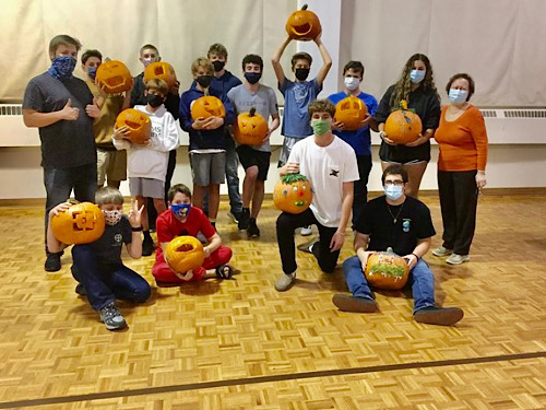 SENIOR COSTAS DELIDAKIS volunteers at his church during the Halloween season to help prepare meals for those in need.  Volunteers also hosted a pumpkin carving competition.
