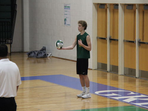 SENIOR TYLER POOLE prepares to serve the ball to the opposing team, hoping for an ace.  Thus far, the boys have gone 5-1 this season. 