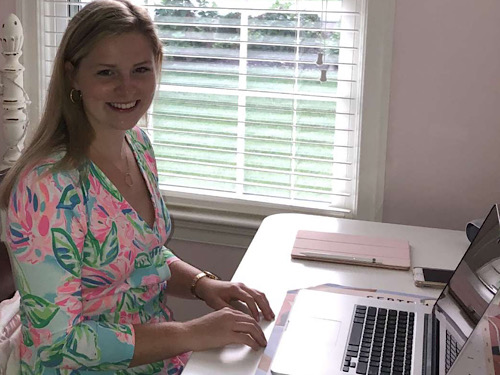 SENIOR ELIZABETH PARSONS expresses her love for learning as she works diligently from home on assignments. According to Parsons, she feels that its necessary to get out of bed, get dressed and have her own space to work virtually.