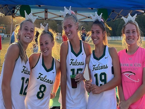 SENIORS FIELD HOCKEY players celebrate their last home game as Lady Falcons. Families, friends, and teammates helped to put together the annual Senior Night celebration.