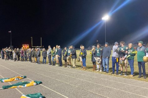 SENIORS TRADITION REQUIRES each sports season are announced one by one, walking hand and hand with their family. Seniors from football, cheer, and dance were all recognized.