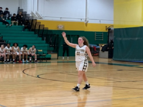 SENIOR MADELINE MASCITTI calls to teammates for the ball during the basketball game this week. Basketball is just one of the many activities Mascitti has involved herself in during her time as a Falcon.