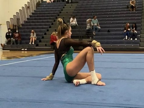 JUNIOR PEYTON WILSON performs her floor routine in the Ocean lakes gymnasium last week. According to Wilson, she did not feel like it was her best performance, but knows what she aspects of the routine she needs to work on. 