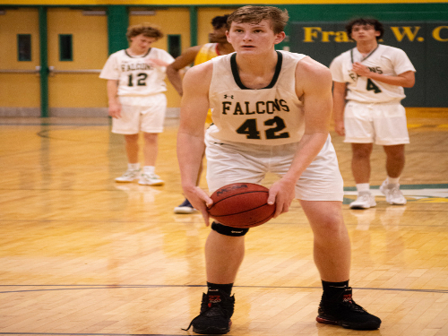 SOPHOMORE BEN NACEY shoots a key free throw. His efforts, however, were not enough for a Falcons victory. 