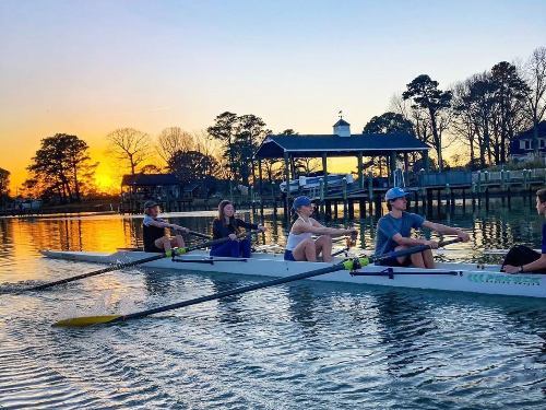 NOVICE ROWERS GLIDE through the calm water. Being one with nature is the best part of the sport for many of the athletes. 