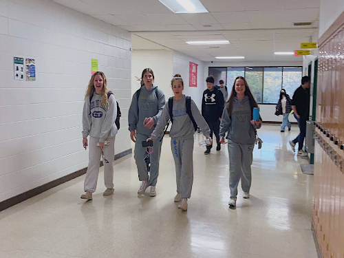 JUNIORS AMELIA KECK, Elyse Unger, Lizzy Goldstein, and Addie Froelich sport their groutfits to show their school spirit. Groutfit day was represented by students who wore all grey outfits.