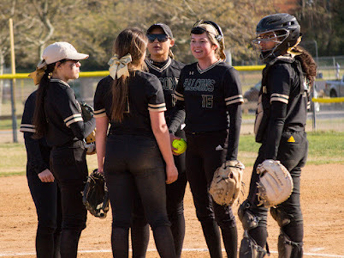 FALCON SOFTBALL PLAYERS meet as a team during a home game last season. The team is working toward bringing progress from last season to Fall Ball using mindful activities as a catalyst.