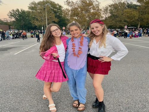 SCA HOSTED ITS annual Boo Bash event last night for local trick or treaters. to  put on the annual Boo Bash. Seniors (left to right) sophomore Leena Harkin and seniors Lizzy Goldstein and Amelia Keck put time and effort into continuing the tradition and to keep everyone that attends safe and happy.