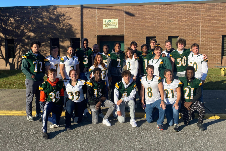 SENIOR FOOTBALL PLAYERS dedicate jerseys with their numbers to a favorite teacher. The teachers sported the jerseys at school on Friday. 