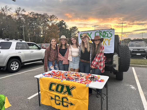 THE GIRLS CROSS country team gets into the spirit of Halloween by dressing in a western theme. They sported their ensembles at Boo Bash.