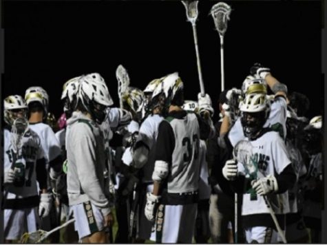 THE BOYS LACROSSE team rallies after a big win on senior night.  The Falcons went undefeated versus First Colonial throughout the season. 