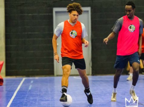 SENIOR DAVID HARTWELL  dribbles a futsol ball in  preparation for the upcoming season. Hartwells successful soccer career has given him the opportunity to play at the collegiate level in the fall.
